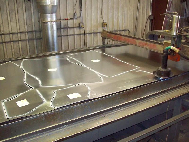 Sheet metal being cut on plasma equipment in WATCO’s fabrication shop