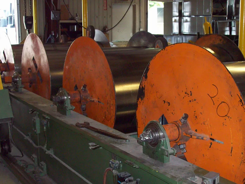 Sheet-metal coil equipment inside WATCO’s fabrication shop